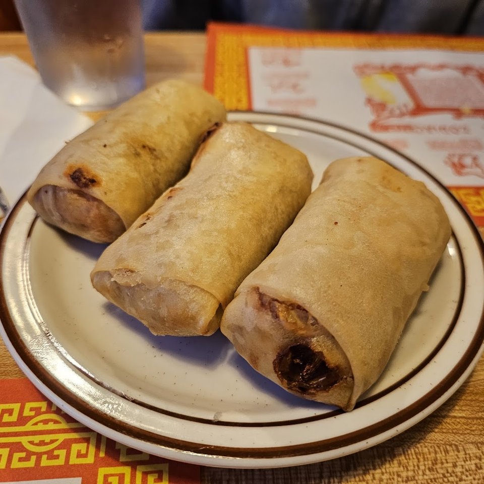 Printed menu with fried rice and pot stickers.