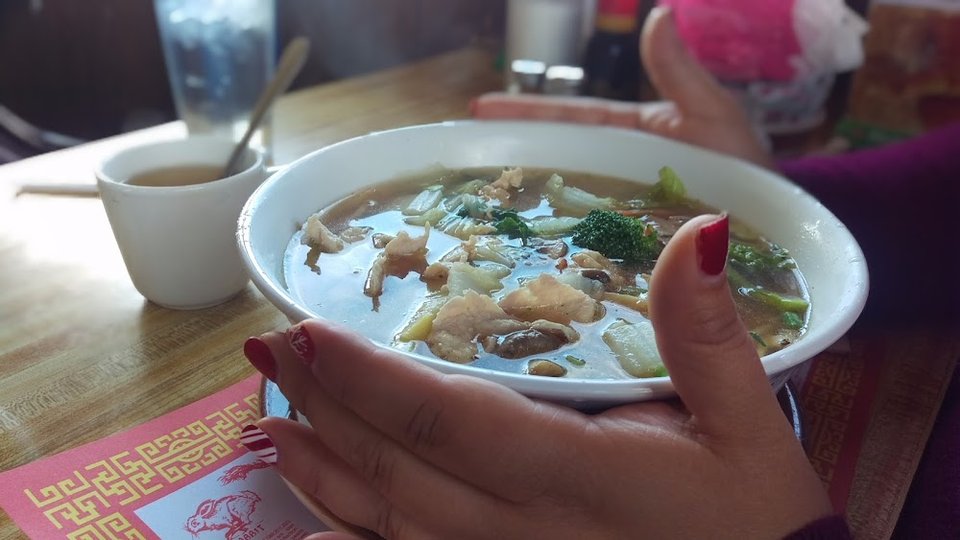 Restaurant menu listing soups, rice, and egg foo young.