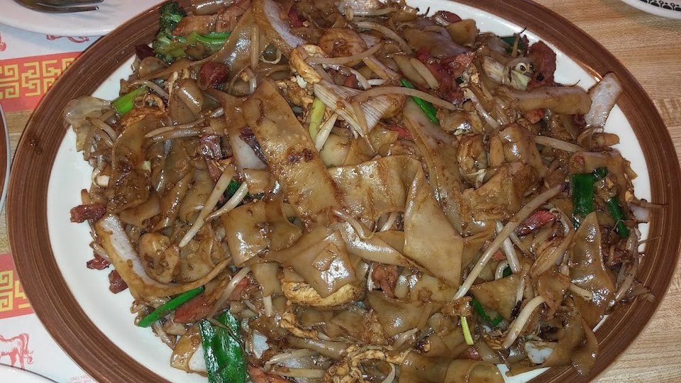 Menu page with appetizers and noodle dishes.